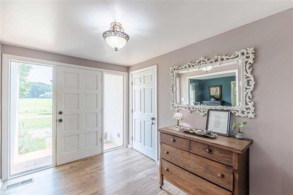 2229 South Van Wert Road Villa Rica, GA 30180 - Photo 2 of 92 a room with a bed and a mirror on the dresser