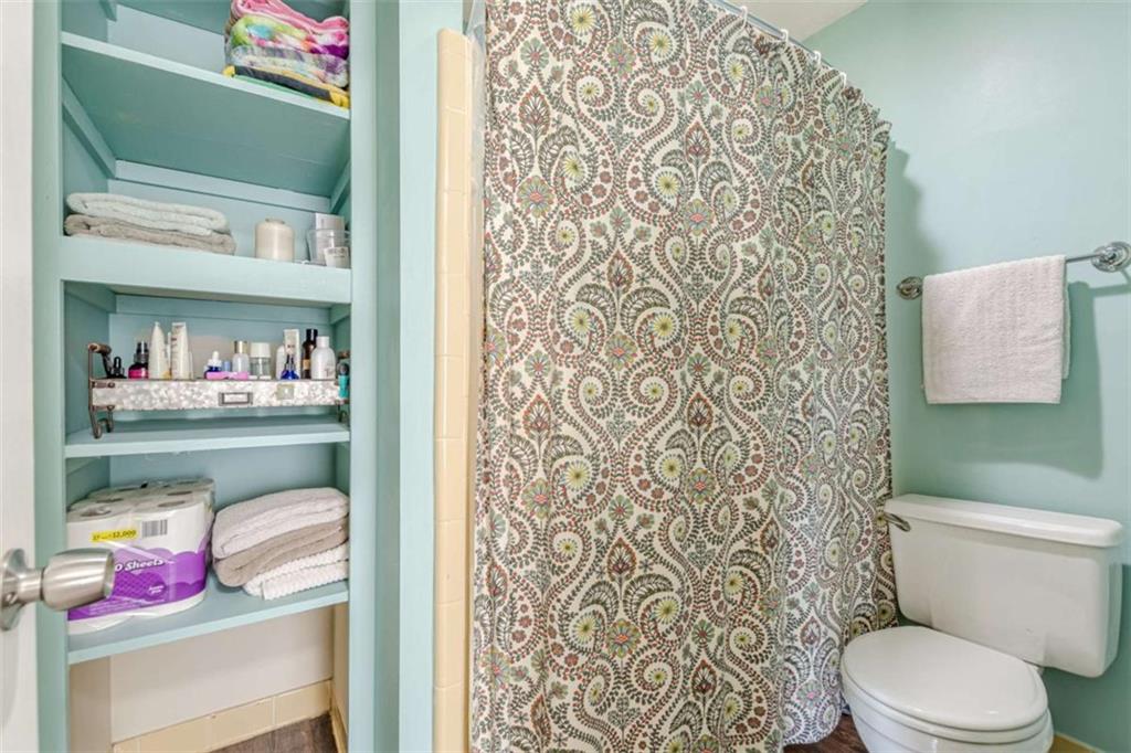 2229 South Van Wert Road Villa Rica, GA 30180 - Photo 25 of 92 a bathroom with a toilet and a shower curtain