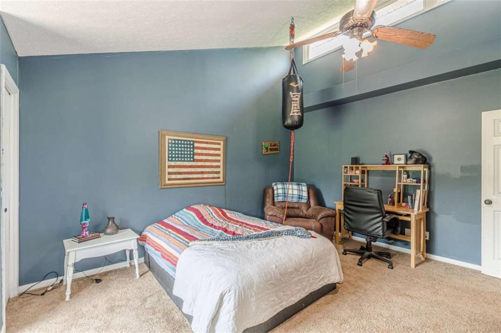 2229 South Van Wert Road Villa Rica, GA 30180 - Photo 30 of 92 a bedroom with a bed and a chair