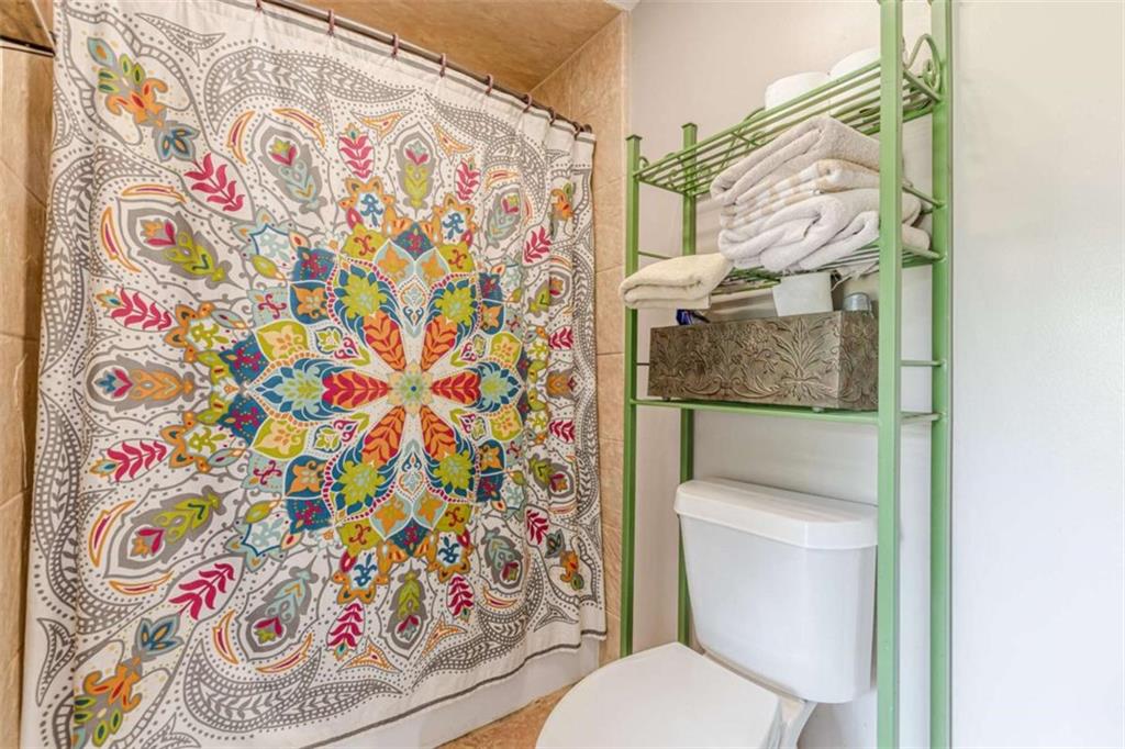 2229 South Van Wert Road Villa Rica, GA 30180 - Photo 34 of 92 a white toilet sitting next to a shower curtain