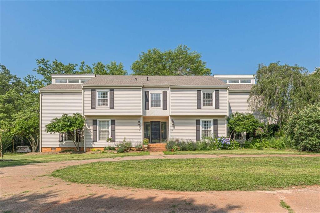 2229 South Van Wert Road Villa Rica, GA 30180 - Photo 47 of 92 a front view of a house with a garden
