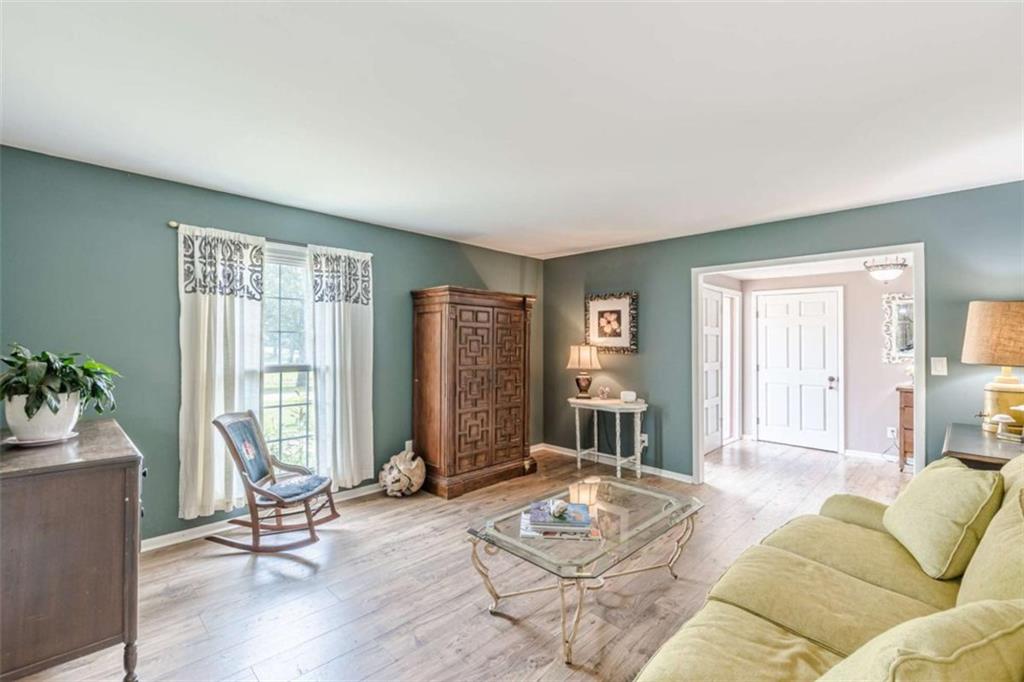 2229 South Van Wert Road Villa Rica, GA 30180 - Photo 6 of 92 a living room with furniture and floor to ceiling windows