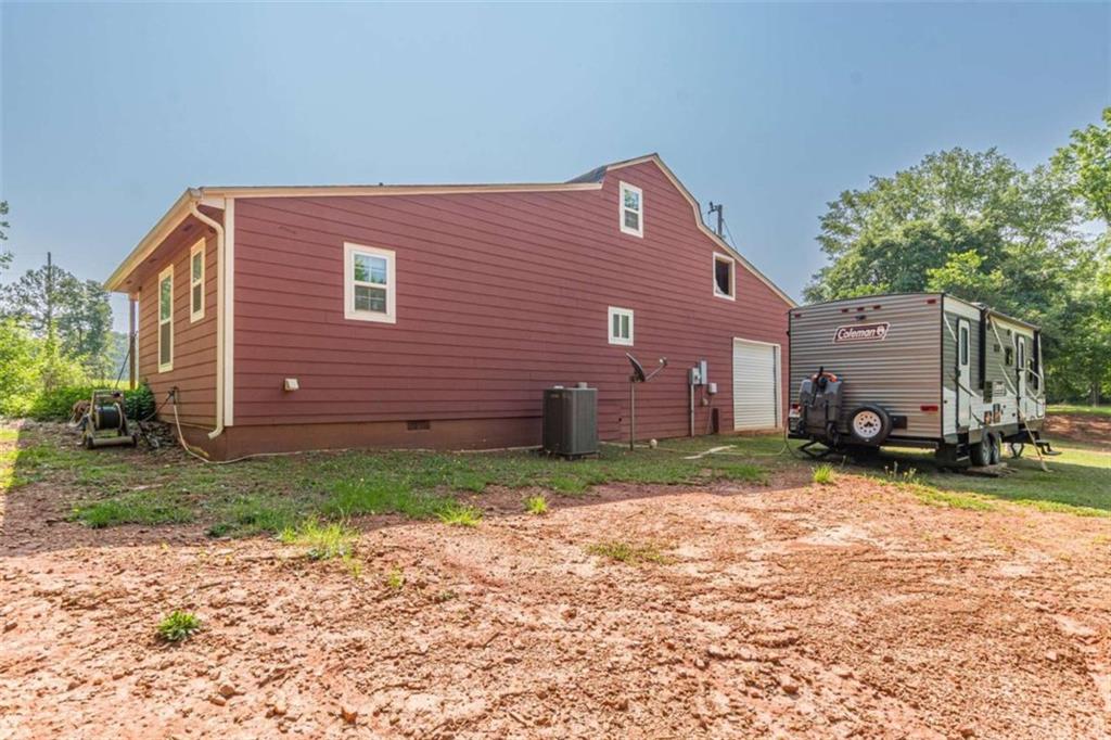 2229 South Van Wert Road Villa Rica, GA 30180 - Photo 64 of 92 a backyard of a house with barbeque oven