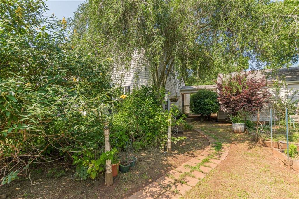 2229 South Van Wert Road Villa Rica, GA 30180 - Photo 70 of 92 a view of a yard with plants and trees