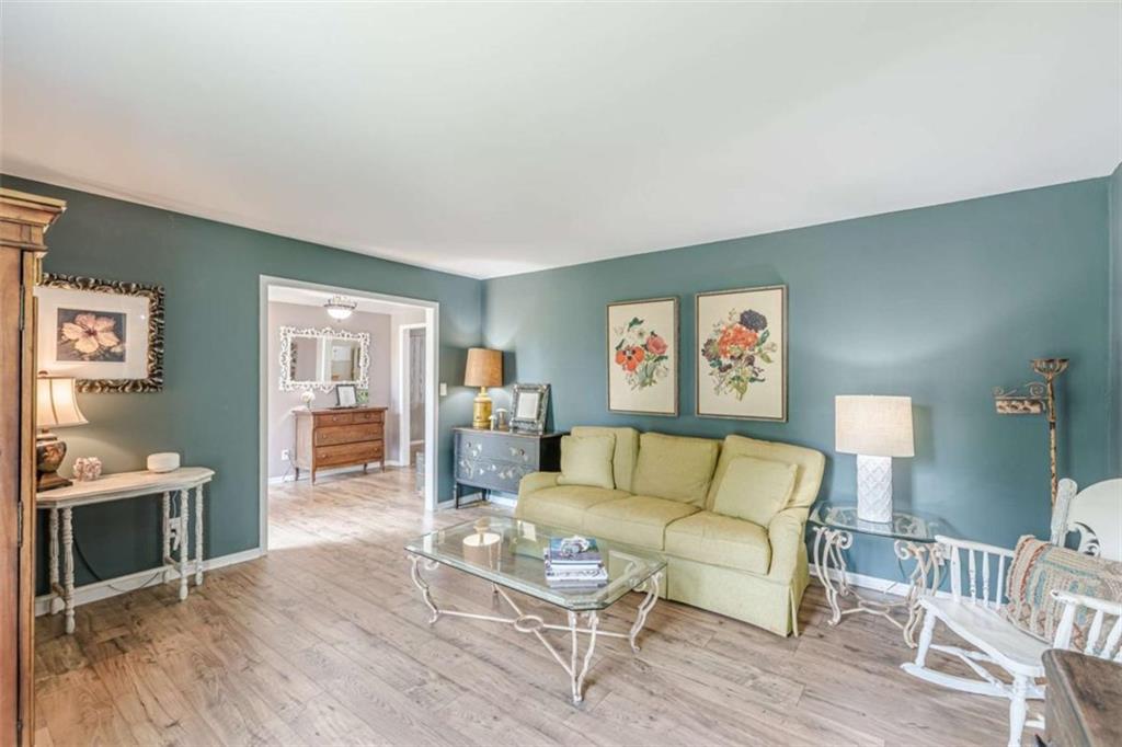 2229 South Van Wert Road Villa Rica, GA 30180 - Photo 7 of 92 a living room with furniture and a wooden floor