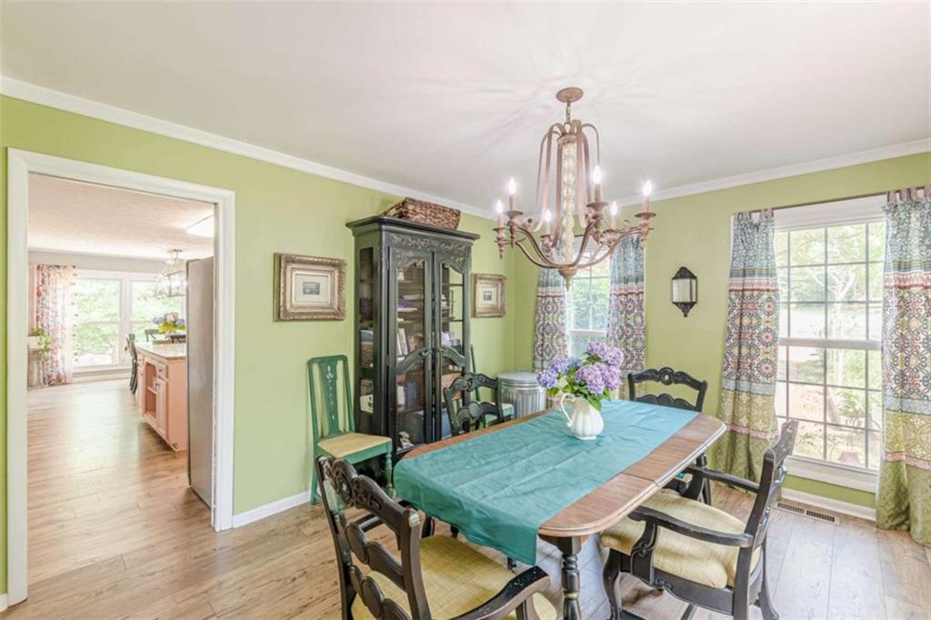 2229 South Van Wert Road Villa Rica, GA 30180 - Photo 8 of 92 a view of a dining room with furniture window and wooden floor