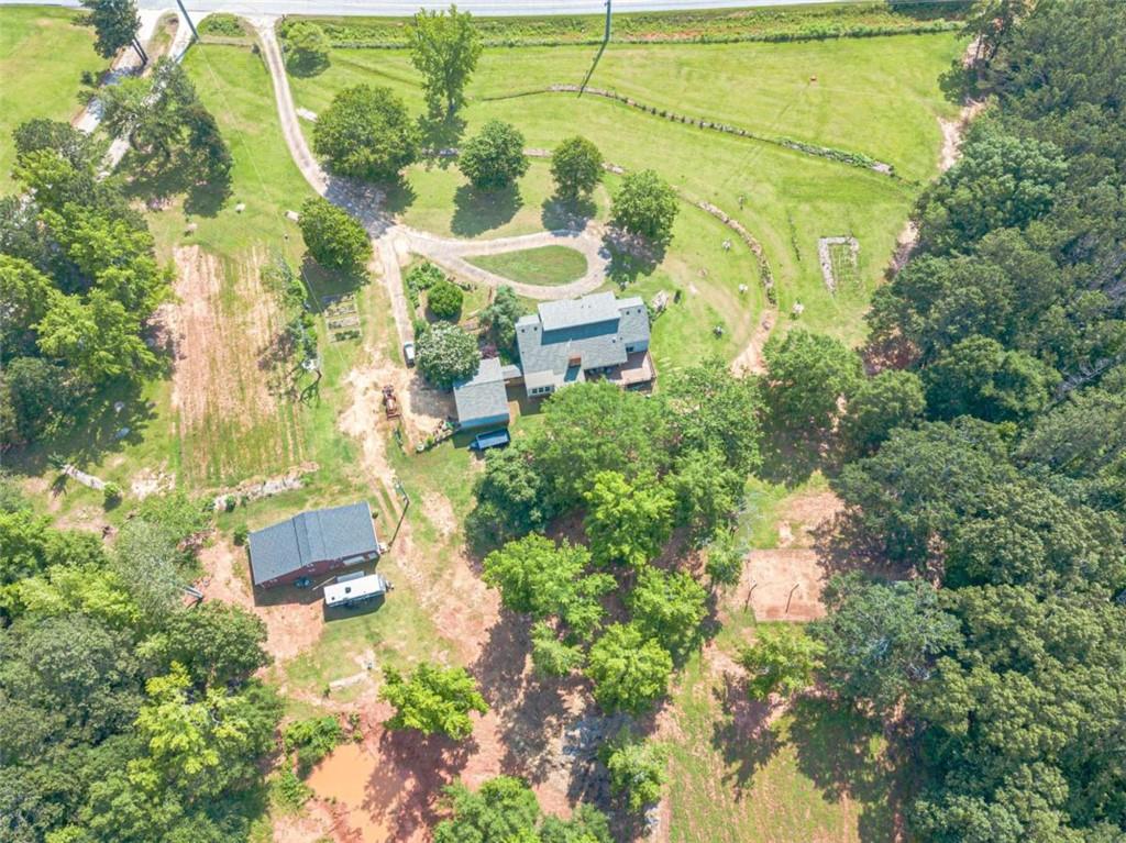 2229 South Van Wert Road Villa Rica, GA 30180 - Photo 87 of 92 an aerial view of residential house with outdoor space and trees all around