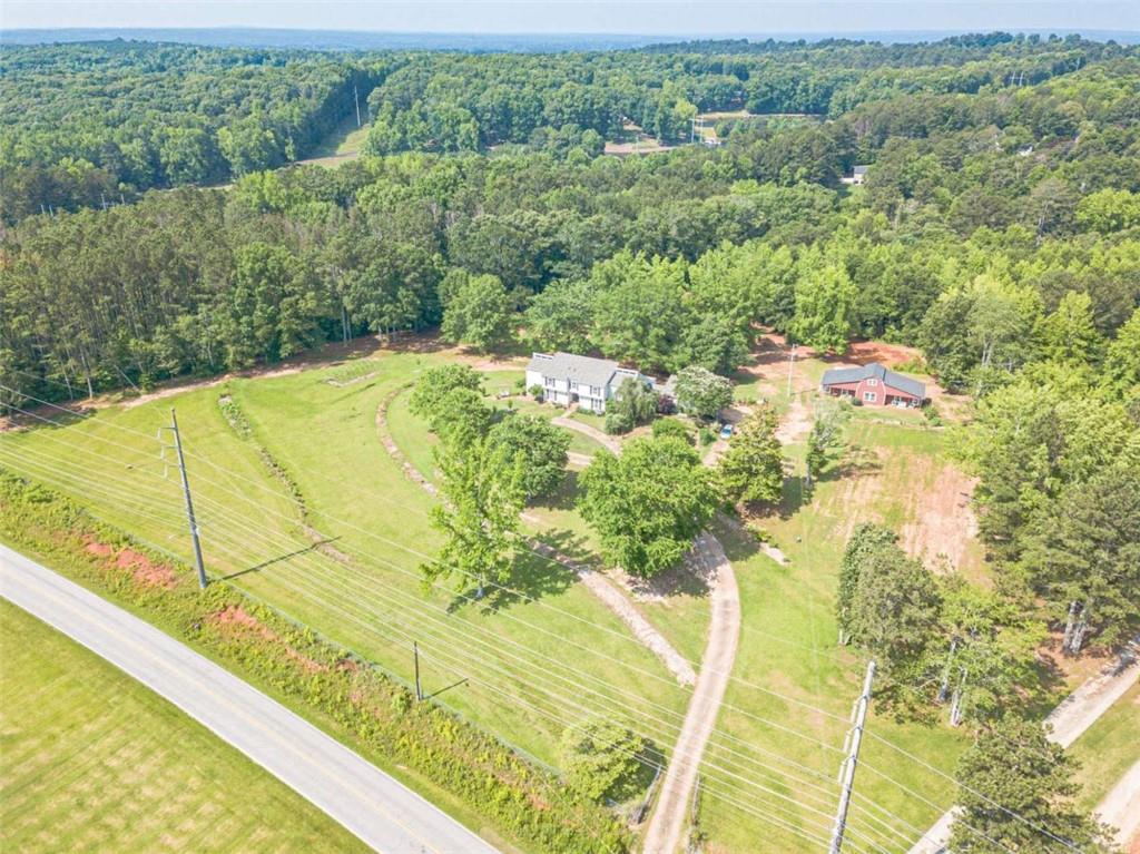 2229 South Van Wert Road Villa Rica, GA 30180 - Photo 92 of 92 a view of a swimming pool and trees in the background
