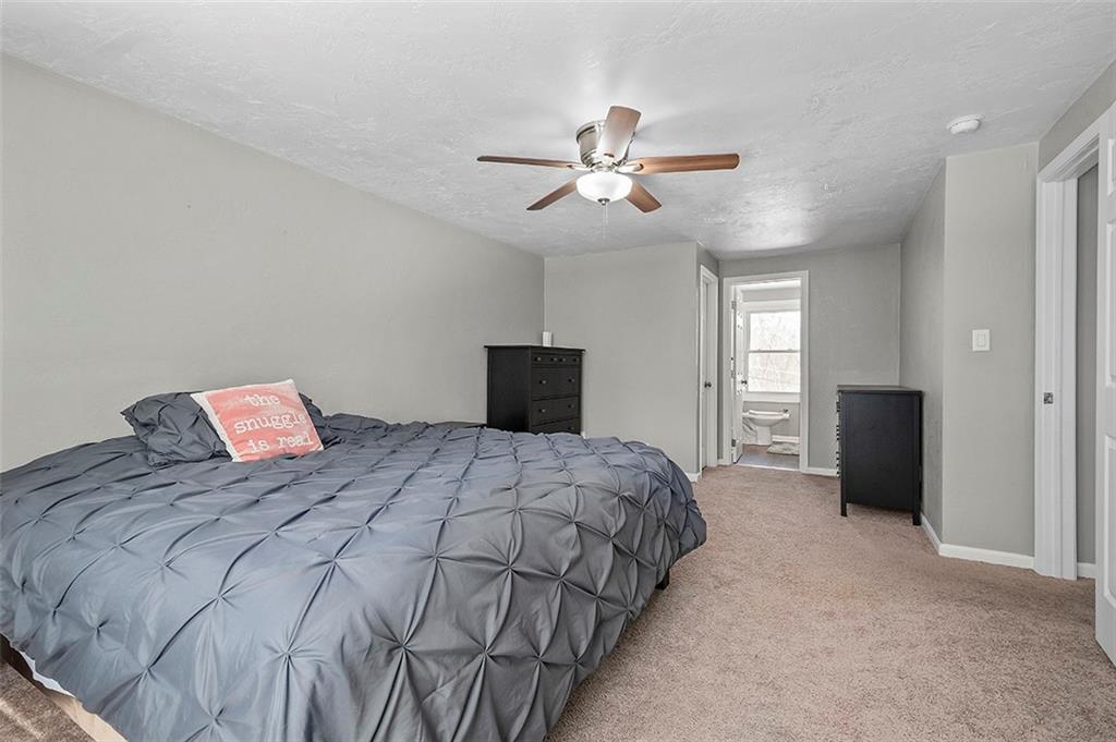 227 Elm Road Pittsburgh, PA 15239 - Photo 15 of 25 a bedroom with a bed and a window