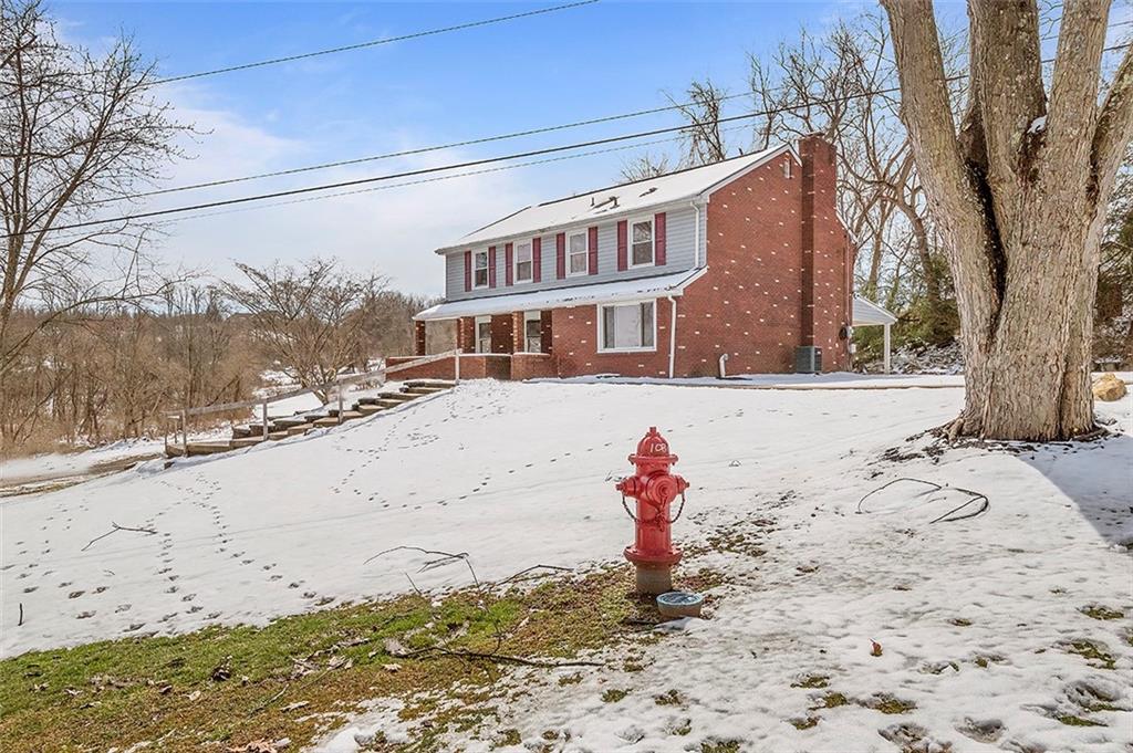 227 Elm Road Pittsburgh, PA 15239 - Photo 2 of 25 a front view of a house with a yard