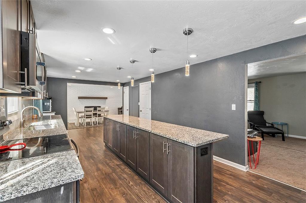 227 Elm Road Pittsburgh, PA 15239 - Photo 4 of 25 a kitchen with sink refrigerator and microwave