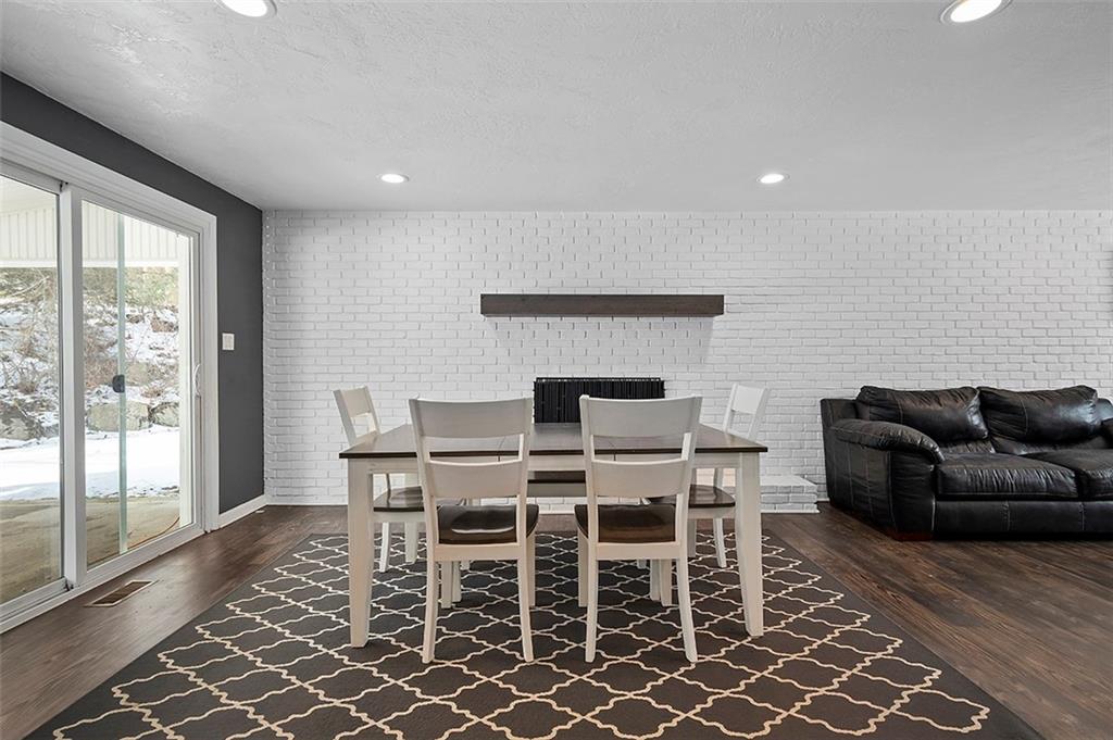 227 Elm Road Pittsburgh, PA 15239 - Photo 7 of 25 a view of a dining room with furniture wooden floor and windows