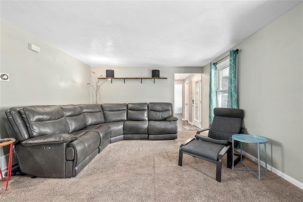 227 Elm Road Pittsburgh, PA 15239 - Photo 9 of 25 a living room with furniture and a window
