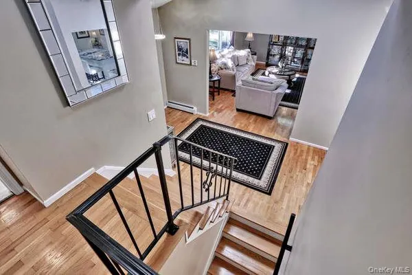 a view of an entryway with wooden floor