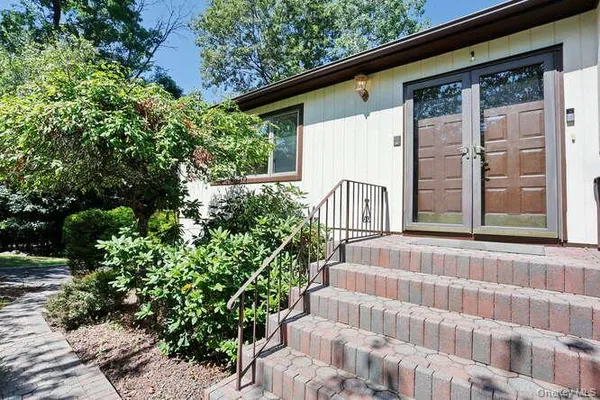 a view of house with an outdoor space