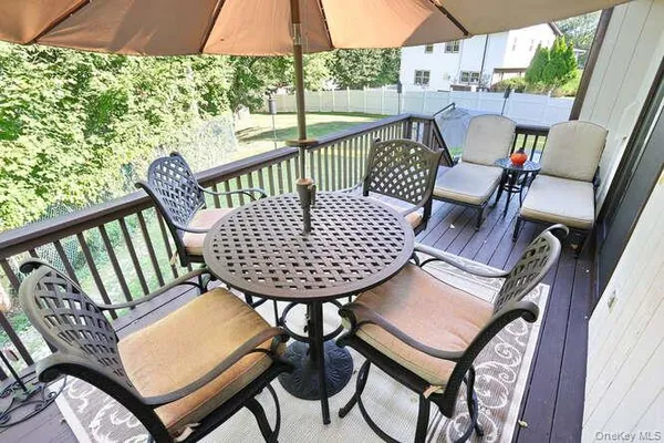a view of a chairs and table in the patio