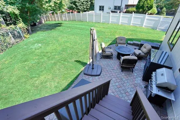 a view of yard with patio and yard