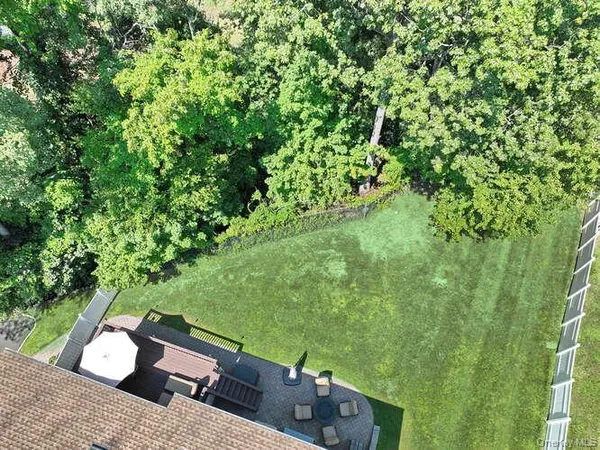 view of an outdoor space with a forest