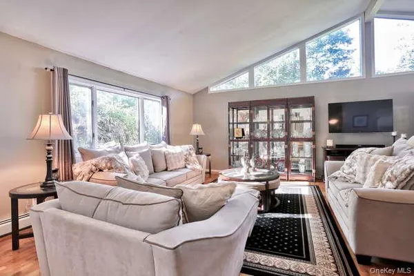 a living room with furniture and a window