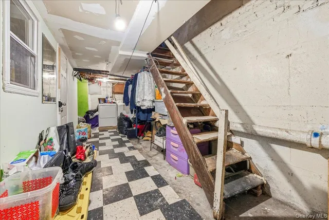a view of walk in closet with clothes
