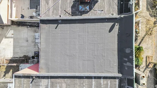 an aerial view of a house with outdoor space