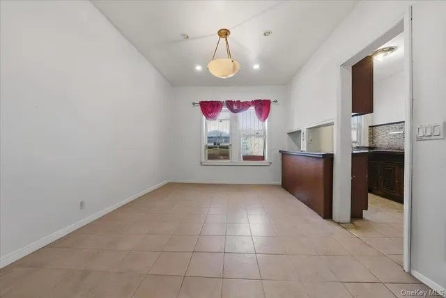 a view of kitchen with furniture and a ceiling fan
