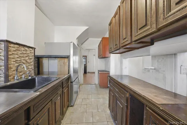 a kitchen with stainless steel appliances granite countertop a sink and cabinets