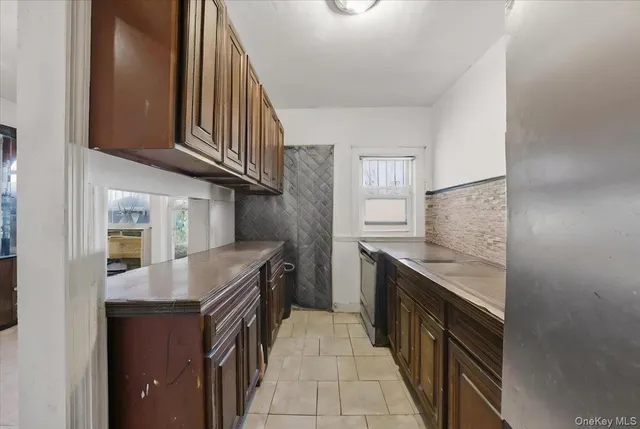 a kitchen with stainless steel appliances granite countertop a stove and a sink