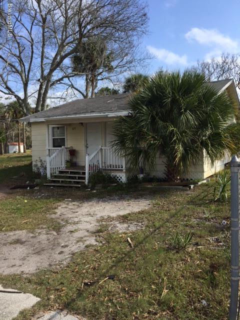 623 Roderick A Harris Sr. Avenue, Unit A Titusville, FL 32796 - Photo 1 of 6 a front view of a house with garden