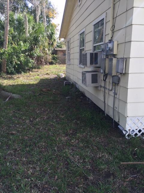 623 Roderick A Harris Sr. Avenue, Unit A Titusville, FL 32796 - Photo 3 of 6 a view of a backyard with plants and large trees
