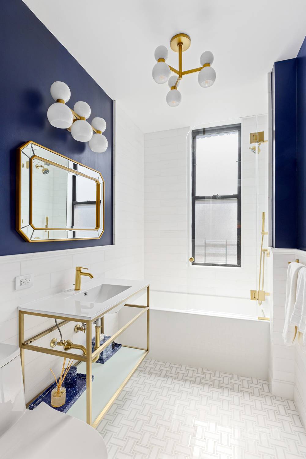 135 West 79th Street, Unit 9A/10A Manhattan, NY 10024 - Photo 10 of 12 a bathroom with a sink mirror and a bathtub