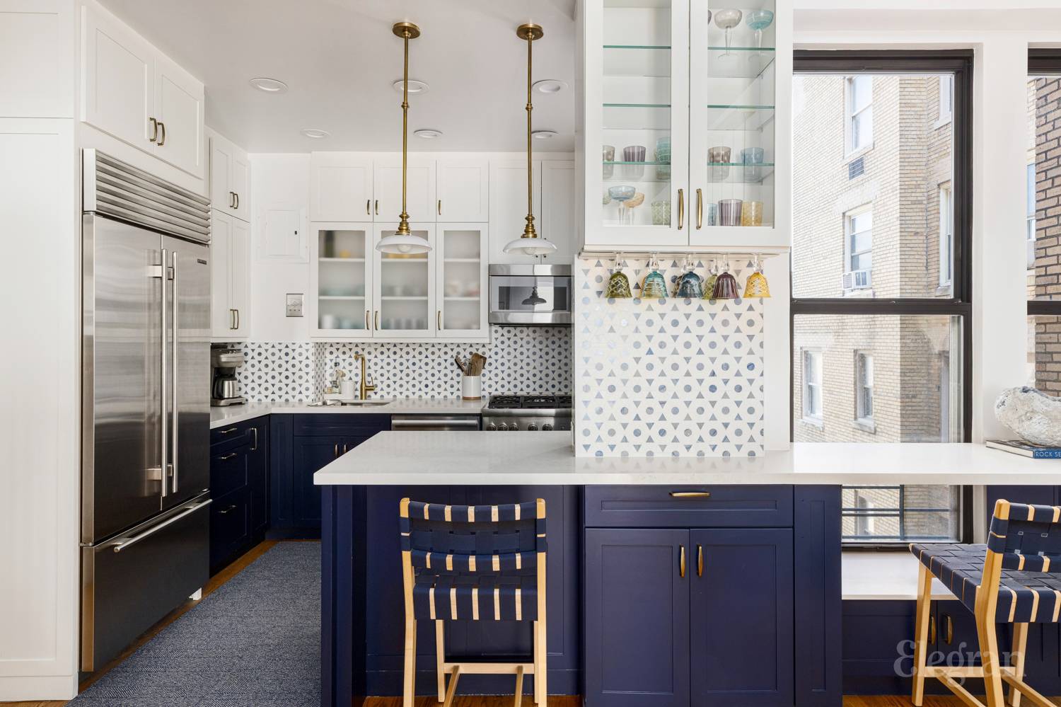 135 West 79th Street, Unit 9A/10A Manhattan, NY 10024 - Photo 4 of 12 a kitchen with stainless steel appliances granite countertop a stove a refrigerator and a wooden cabinets