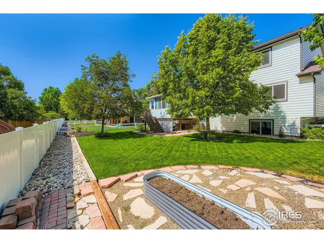 a view of a backyard with a garden
