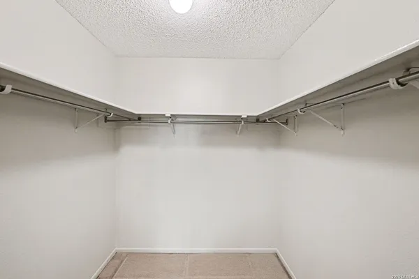 a view of a room with racks on the wall