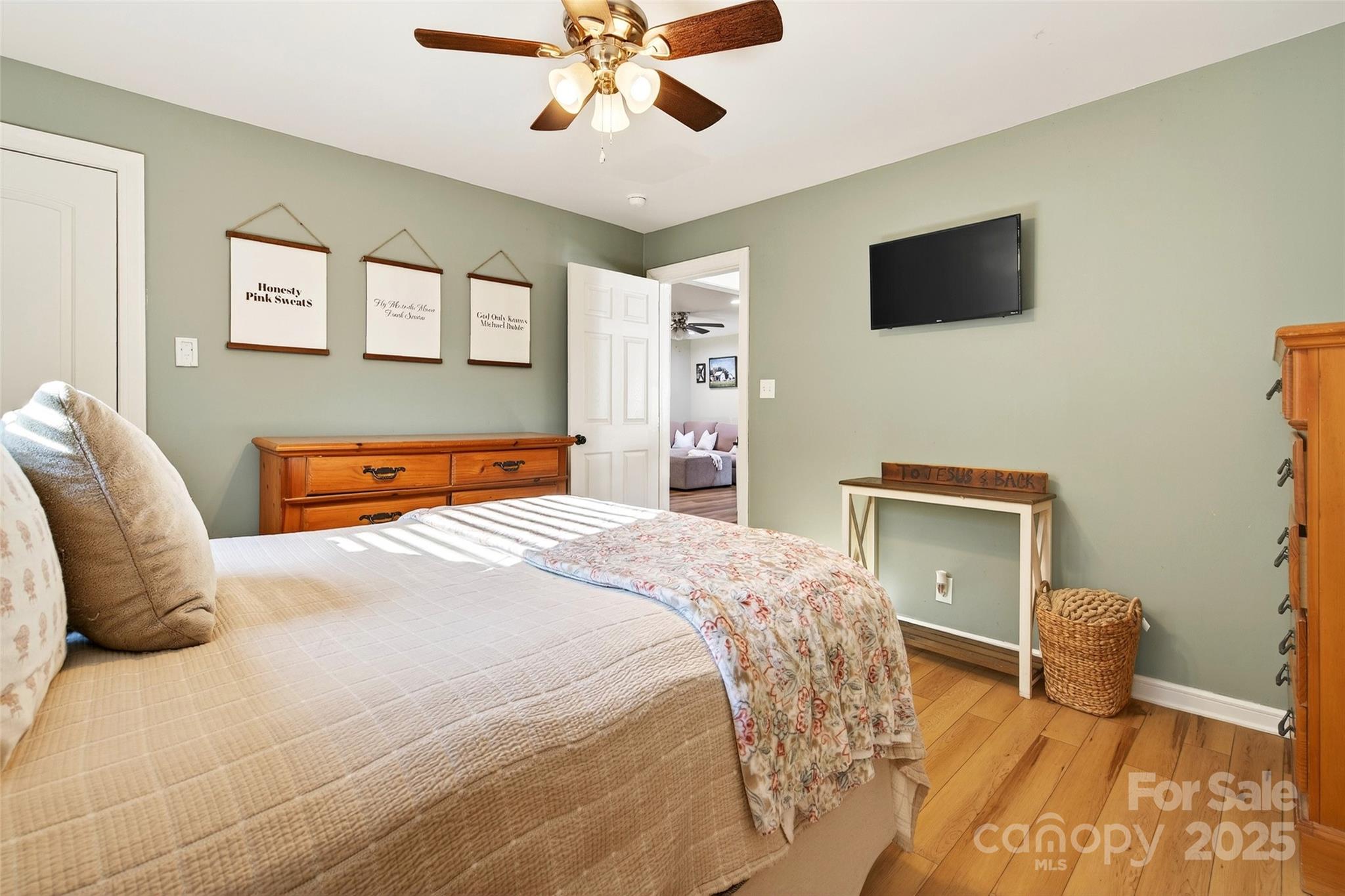 87 2nd Street Marion, NC 28752 - Photo 18 of 31 a bedroom with a bed and a flat screen tv