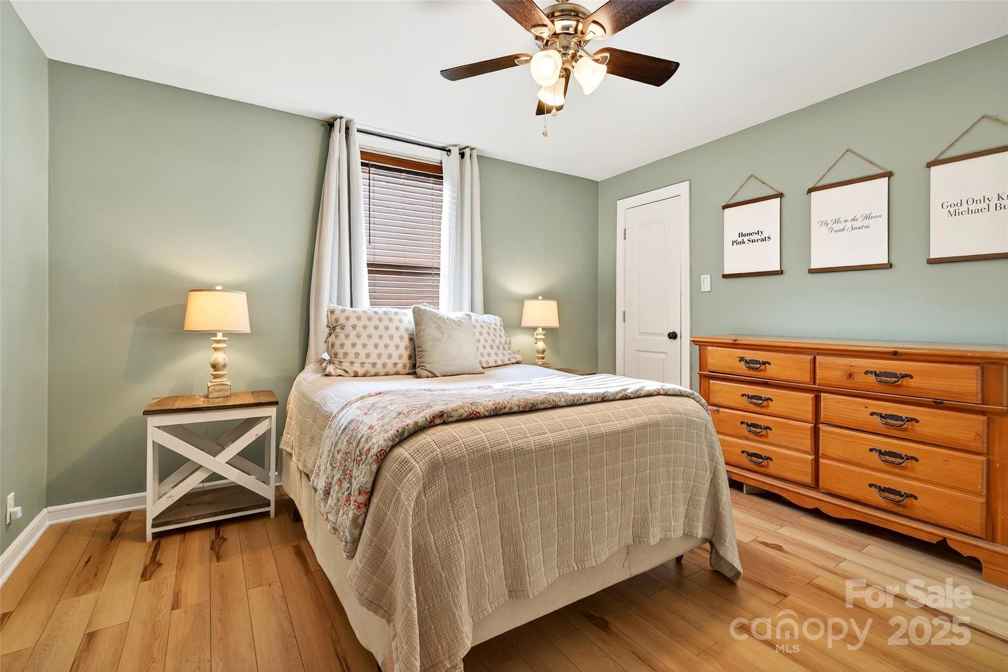 87 2nd Street Marion, NC 28752 - Photo 19 of 31 a bedroom with a bed and wooden floor