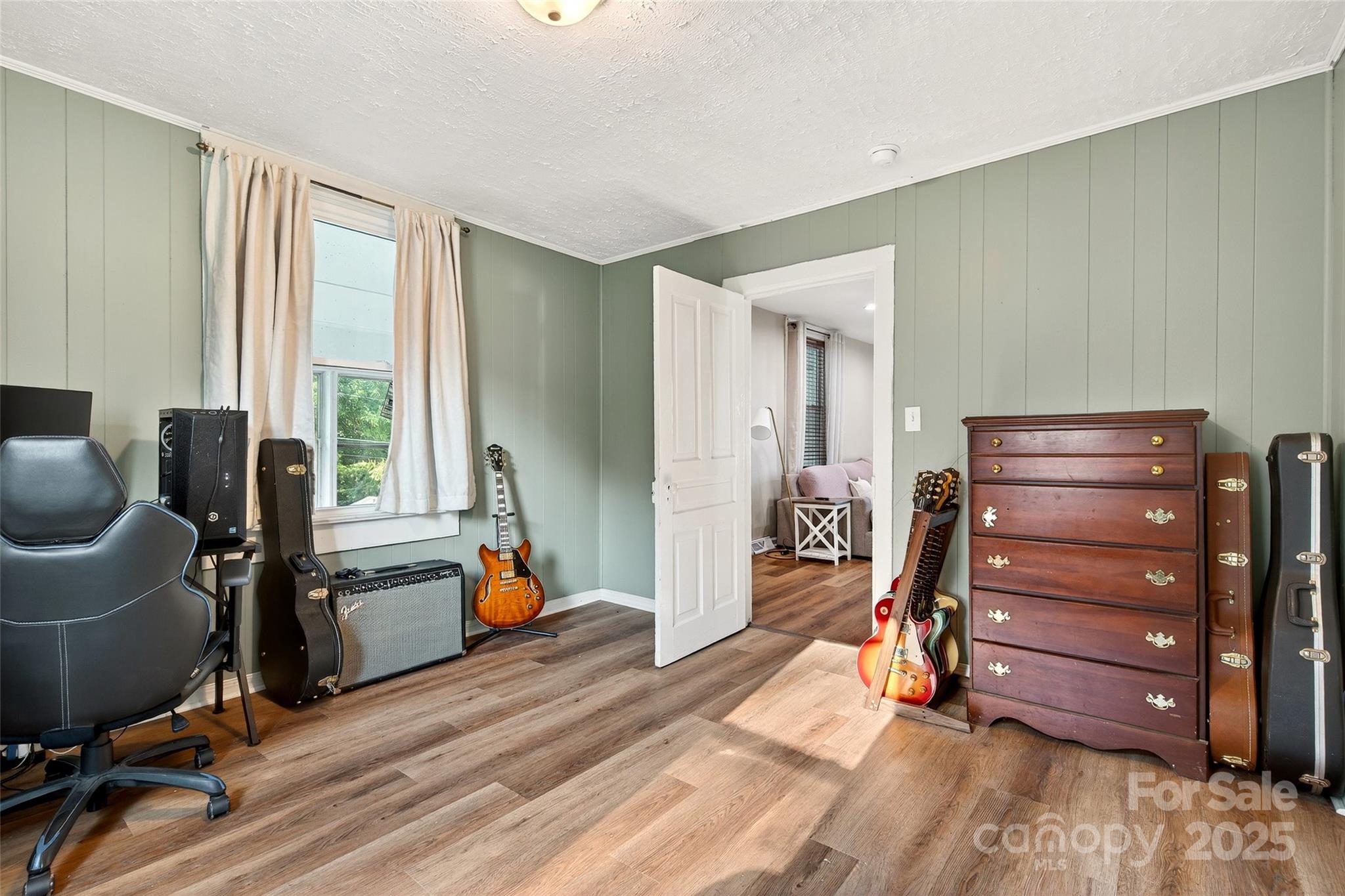 87 2nd Street Marion, NC 28752 - Photo 22 of 31 a bed room with a bed and furniture