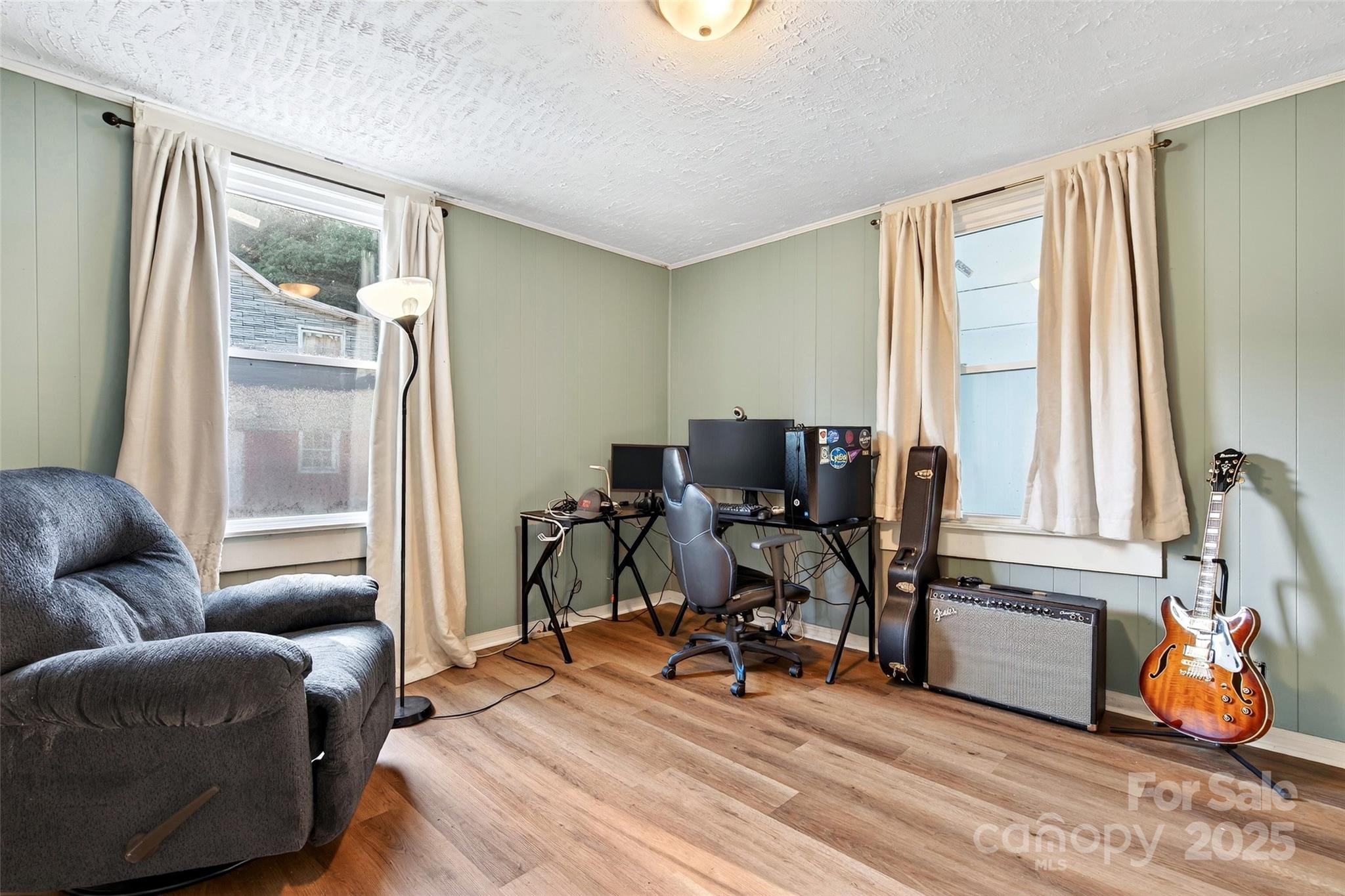 87 2nd Street Marion, NC 28752 - Photo 24 of 31 a view of a livingroom with workspace and a couch
