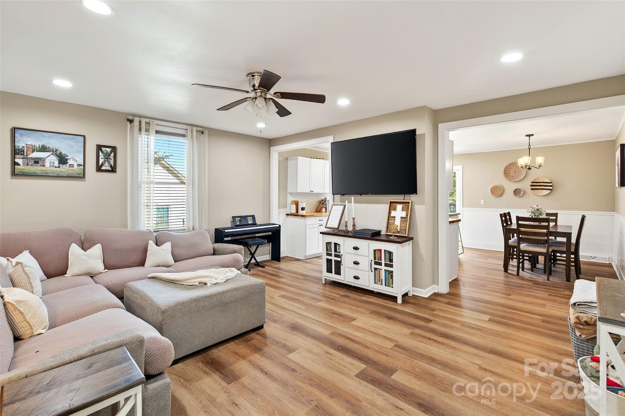 87 2nd Street Marion, NC 28752 - Photo 3 of 31 a living room with furniture and a flat screen tv