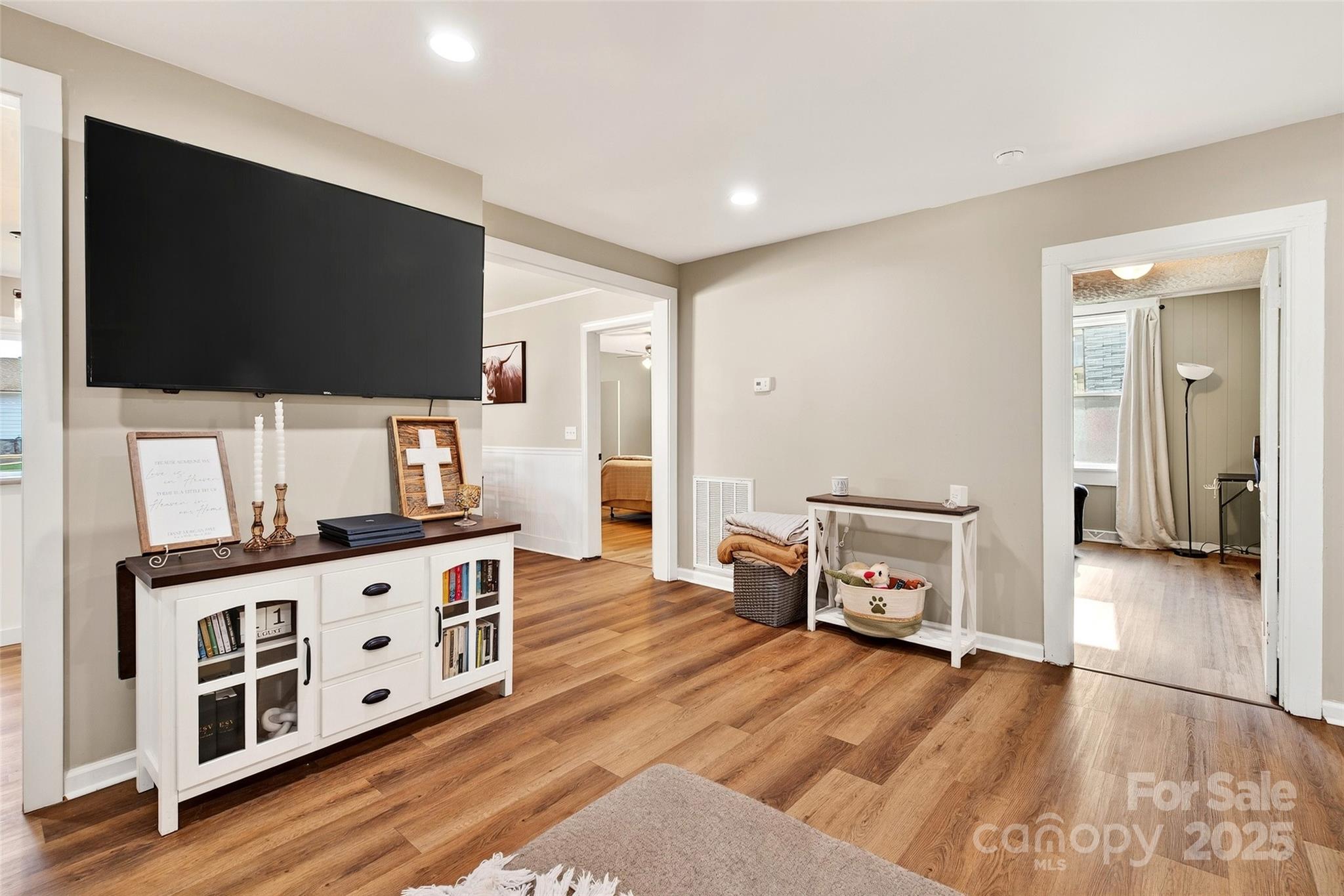 87 2nd Street Marion, NC 28752 - Photo 6 of 31 a living room with furniture and a flat screen tv