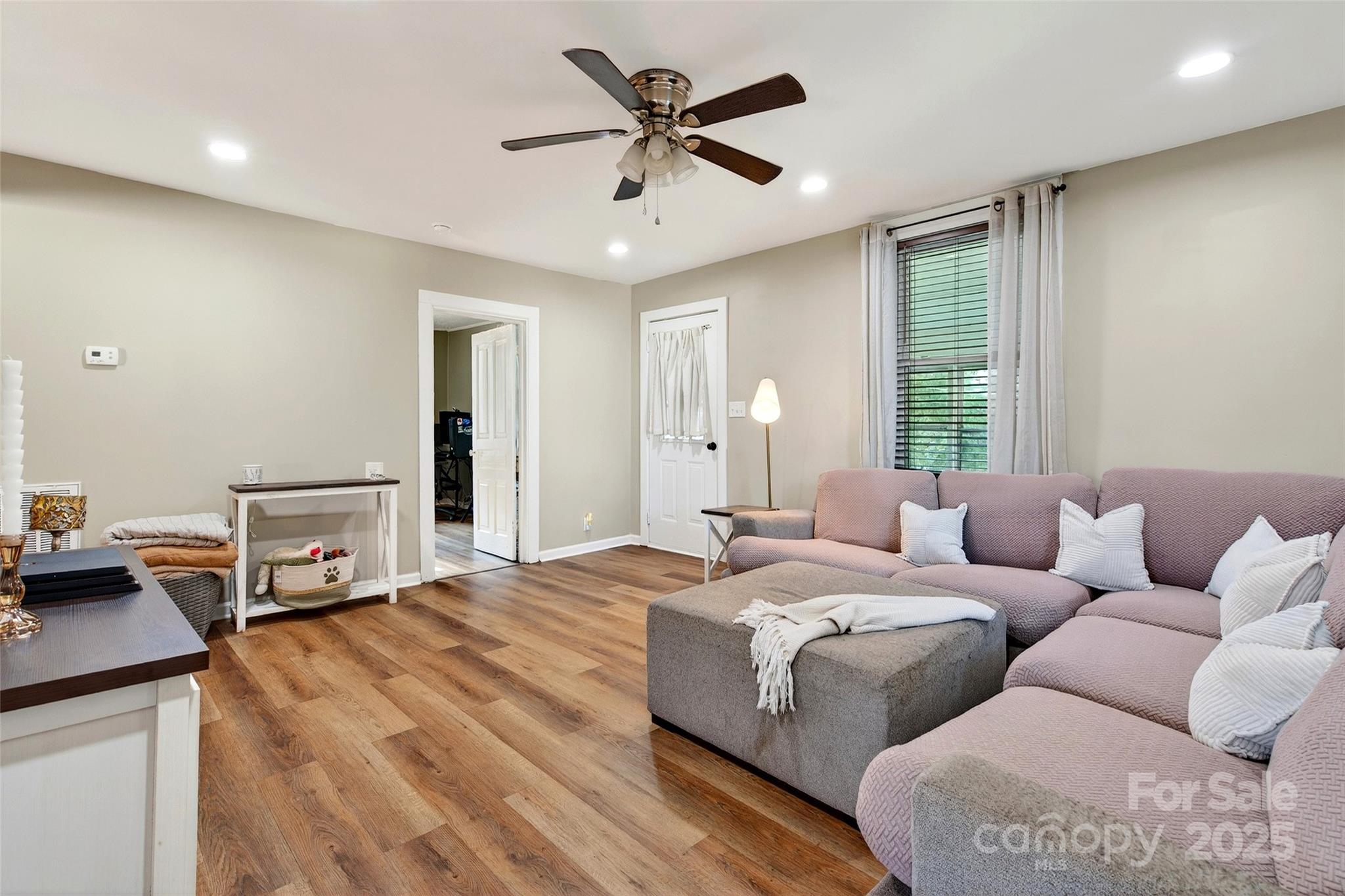 87 2nd Street Marion, NC 28752 - Photo 7 of 31 a living room with furniture and a large window