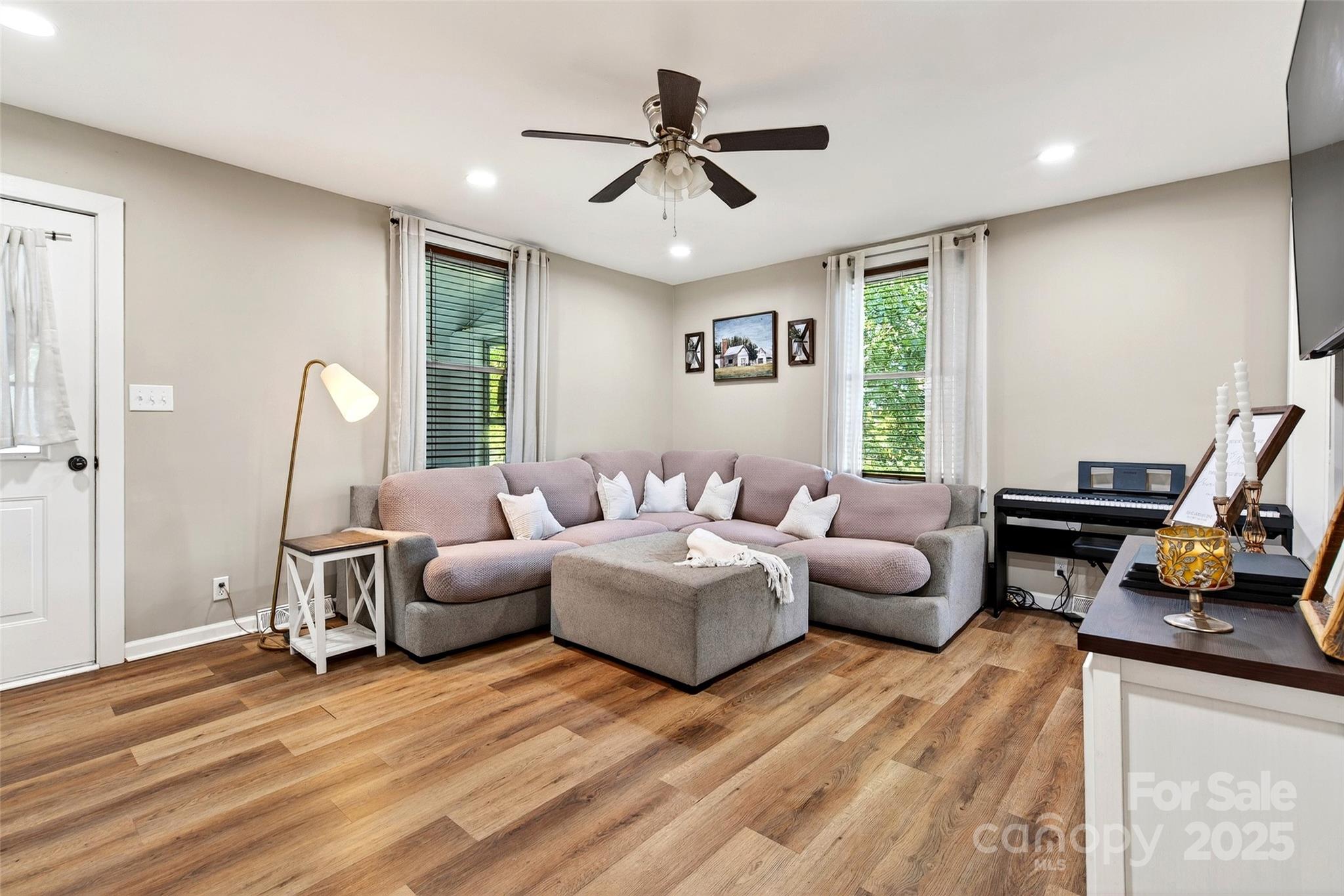 87 2nd Street Marion, NC 28752 - Photo 8 of 31 a living room with furniture and a wooden floor