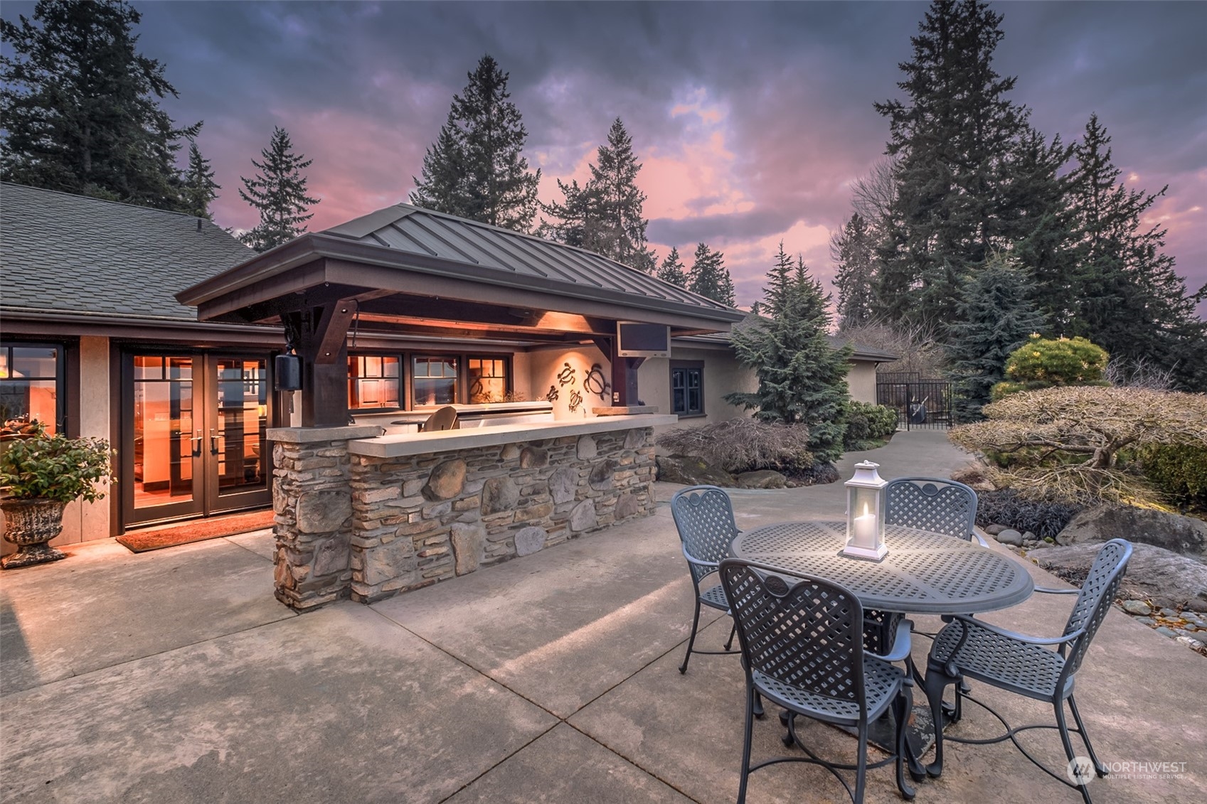 12408 County Line Road East Edgewood, WA 98372 - Photo 34 of 40 a view of a patio with table and chairs and potted plants