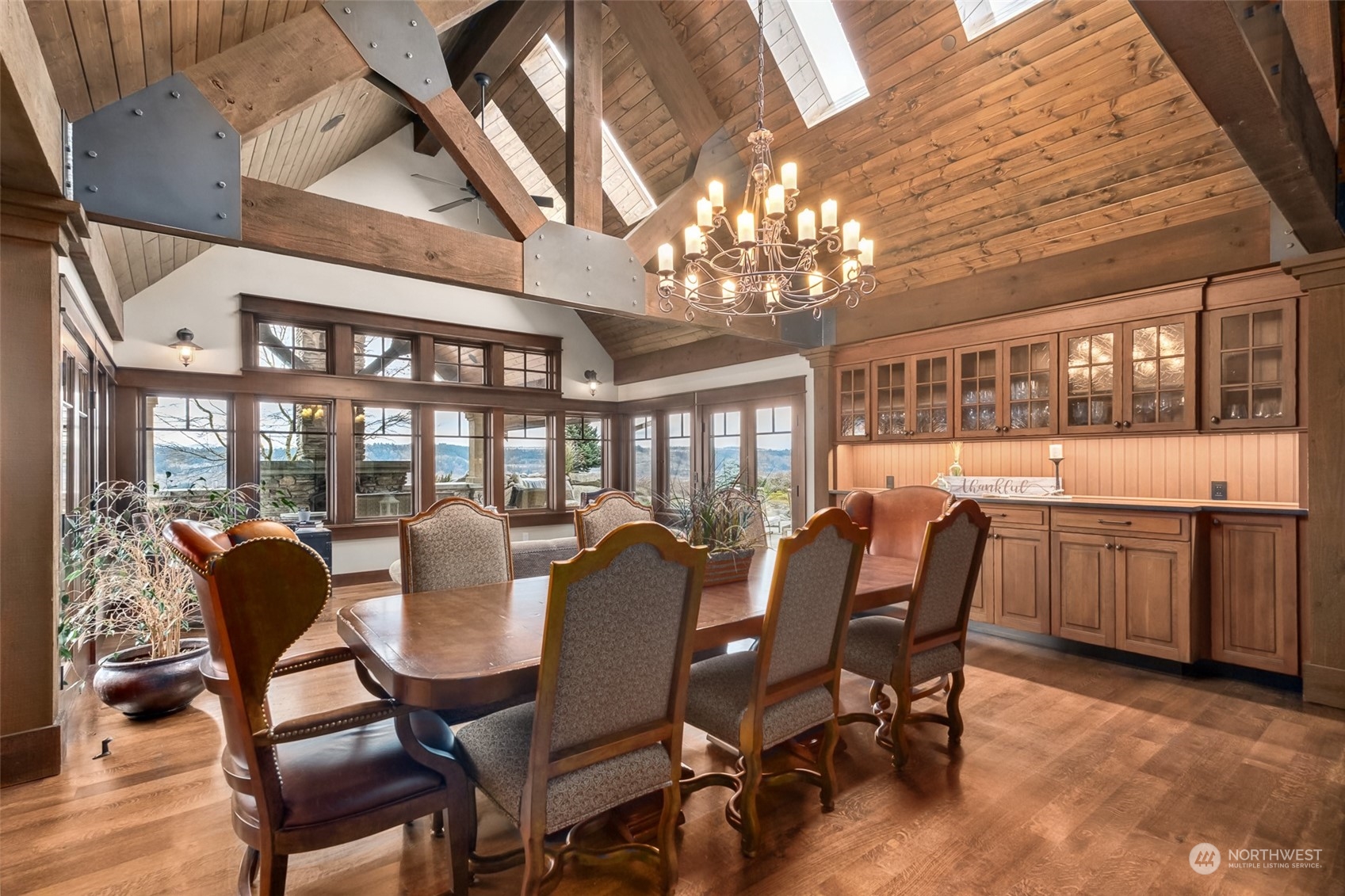 12408 County Line Road East Edgewood, WA 98372 - Photo 9 of 40 a view of a dining room with furniture a chandelier and wooden floor