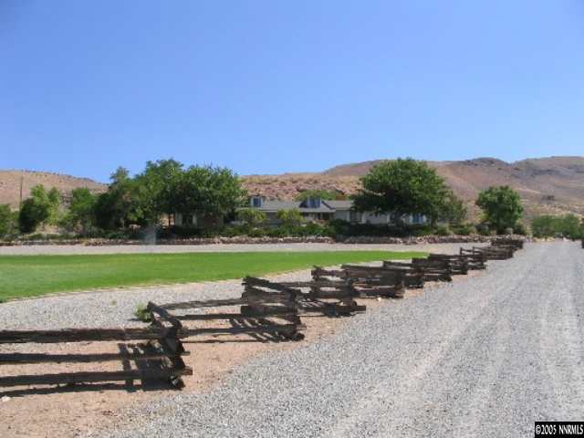 a view of a road with a yard