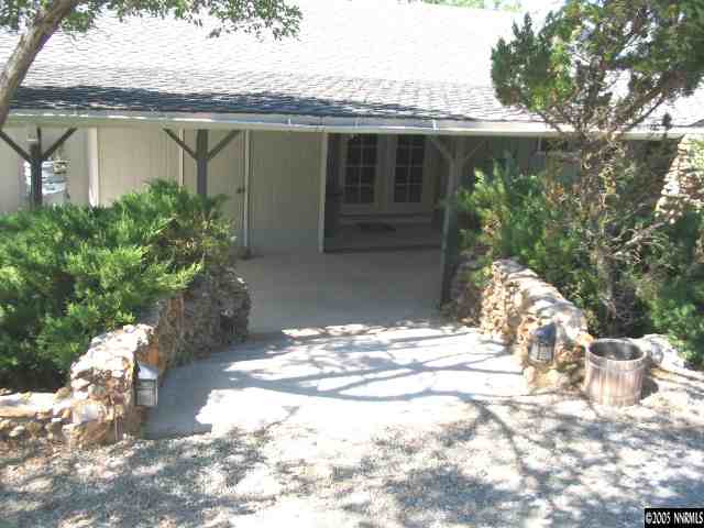 5914 Grass Valley Road Reno, NV 89510 - Photo 2 of 7 a view of a house with a yard and sitting area