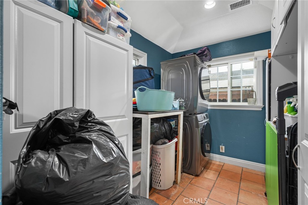 8538 Trey Avenue Riverside, CA 92503 - Photo 18 of 25 a view of walk in closet with clothes and shoes