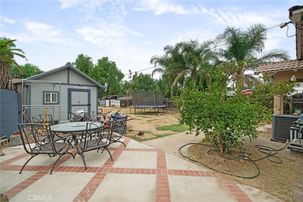 8538 Trey Avenue Riverside, CA 92503 - Photo 20 of 25 a view of a patio with table and chairs and potted plants