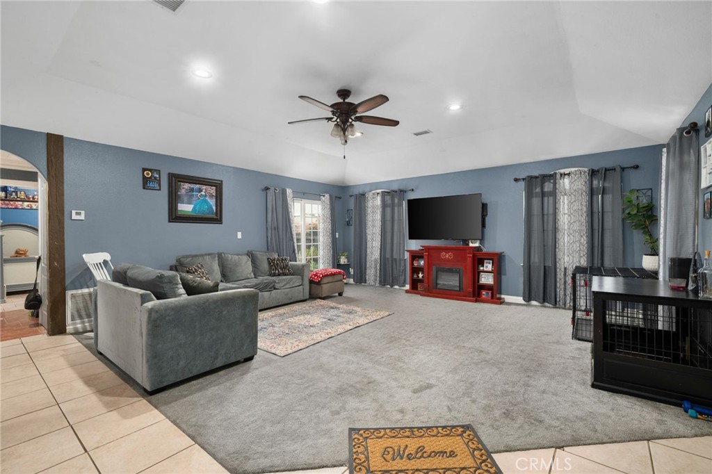 8538 Trey Avenue Riverside, CA 92503 - Photo 3 of 25 a living room with furniture and a flat screen tv