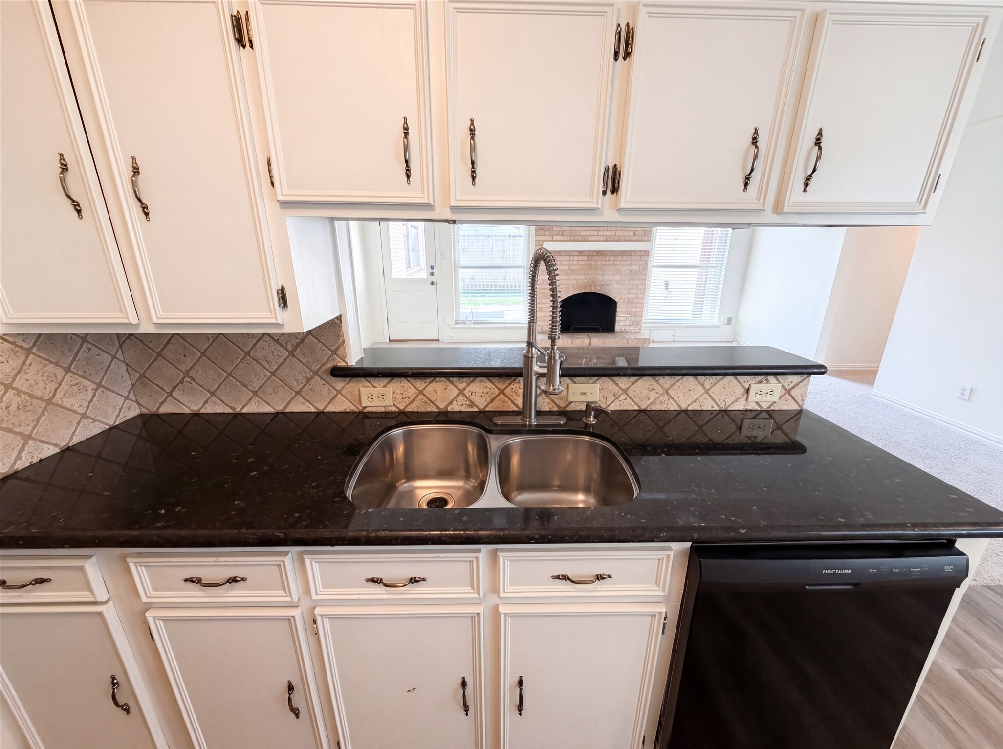 342 Queenstown Road Houston, TX 77015 - Photo 7 of 22 a kitchen with granite countertop a sink and a stove